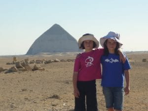 education recruitment agencies Search Associates ANZ siblings with arms around each other with Egyptian pyramid in the background 
