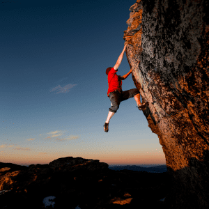growth in international schools search associates man rock climbing