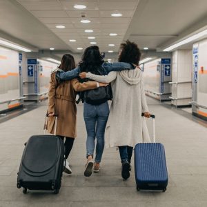 Is it good for a teacher to move schools? Search Associates ANZ three girls walking with suitcases