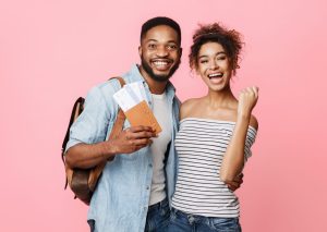 a couple with tickets getting ready to travel| search associates Australia/New Zealand